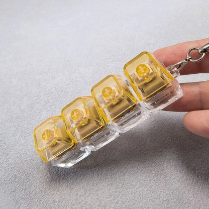 Llavero Fidget con 4 Teclas y Luz - Juguete Antiestres Relajante Adultos - zyntrixe